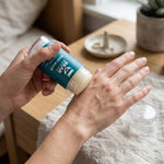 Applying Bear Basics Beef Tallow Body Balm to the back of the hand