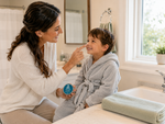 Mom dabbing Bear Basics Beef Tallow Body Bar on her son's nose